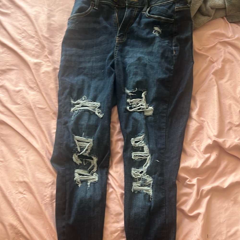 blue jeans with patched rips